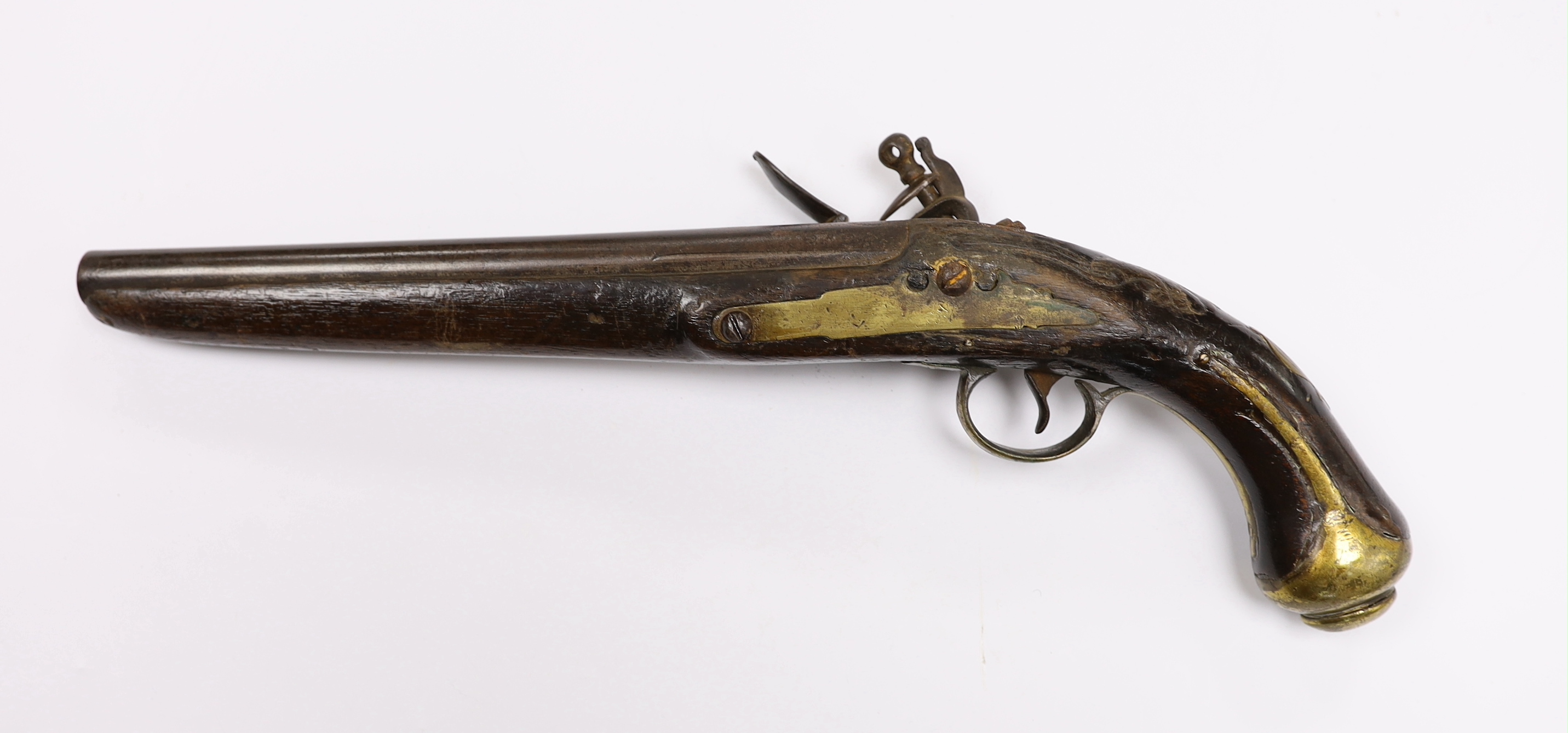 An early 19th century Balkan flintlock holster pistol. with limited engraving to lock and barrel and brass mounts (a.f.)